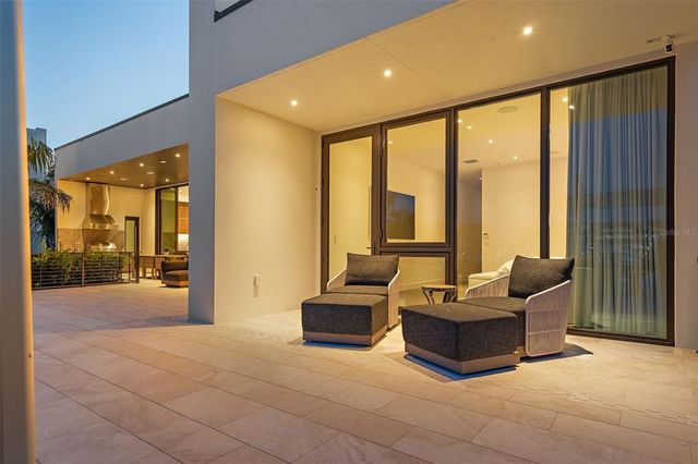 a spacious bedroom with a large bed and a large window