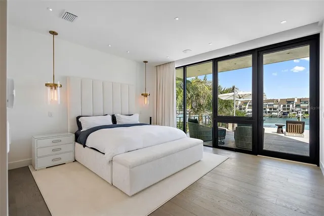 a bedroom with a bed and a table