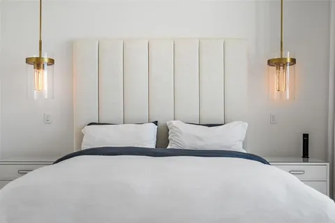 a view of walk in closet with clothes