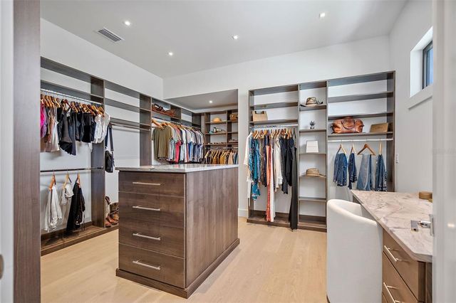 a room with a walk in closet and a window