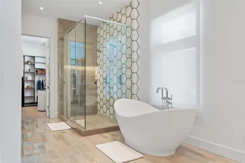 a bathroom with a white shower curtain