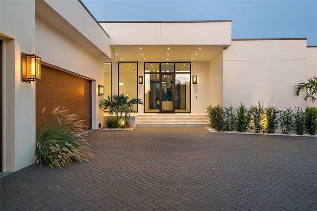 a view of a building with potted plants