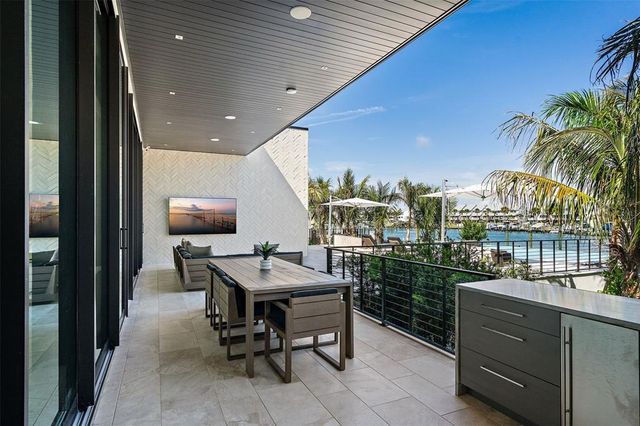 a kitchen with a sink cabinets and window