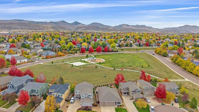 an aerial view of residential houses and outdoor space
