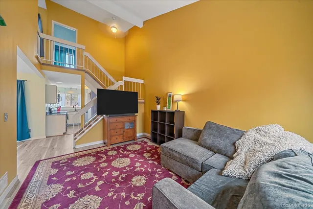 a living room with a couch and a flat screen tv