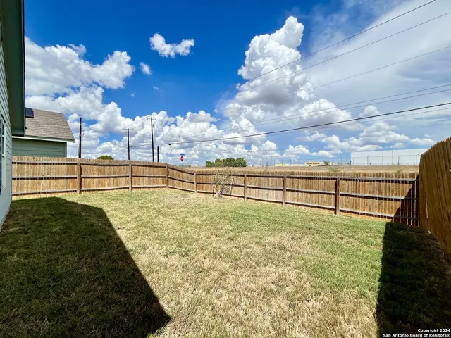 a house view with a backyard space