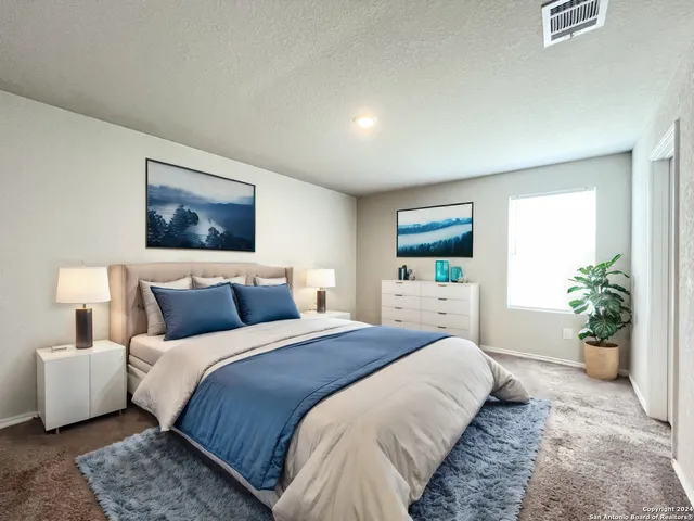 a bedroom with a balcony a bed and a couch