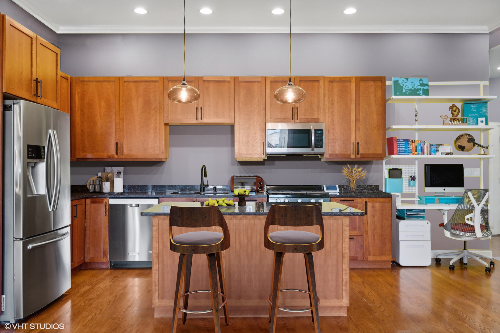 1555 North Wood Street, Unit 302 Chicago, IL 60622 - Photo 6 of 14 a kitchen with stainless steel appliances a stove a refrigerator a sink a stove and chairs with wooden floor