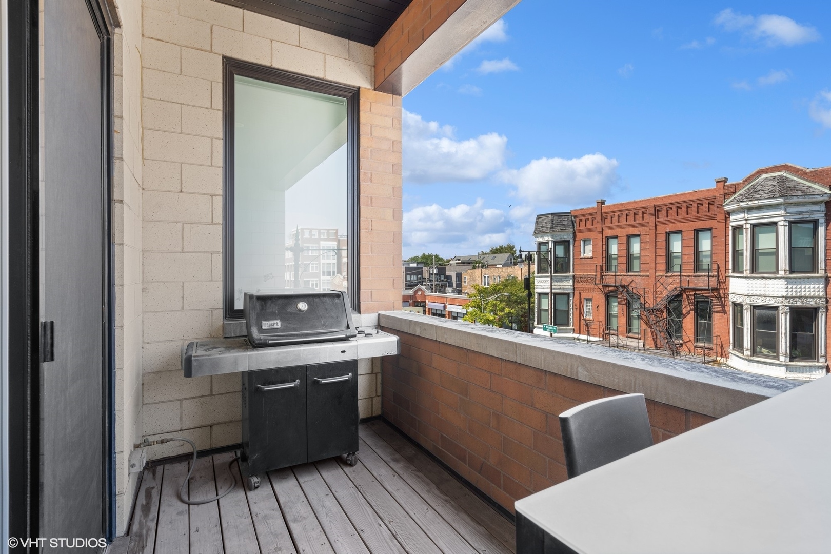 1555 North Wood Street, Unit 302 Chicago, IL 60622 - Photo 9 of 14 a view of city from a balcony