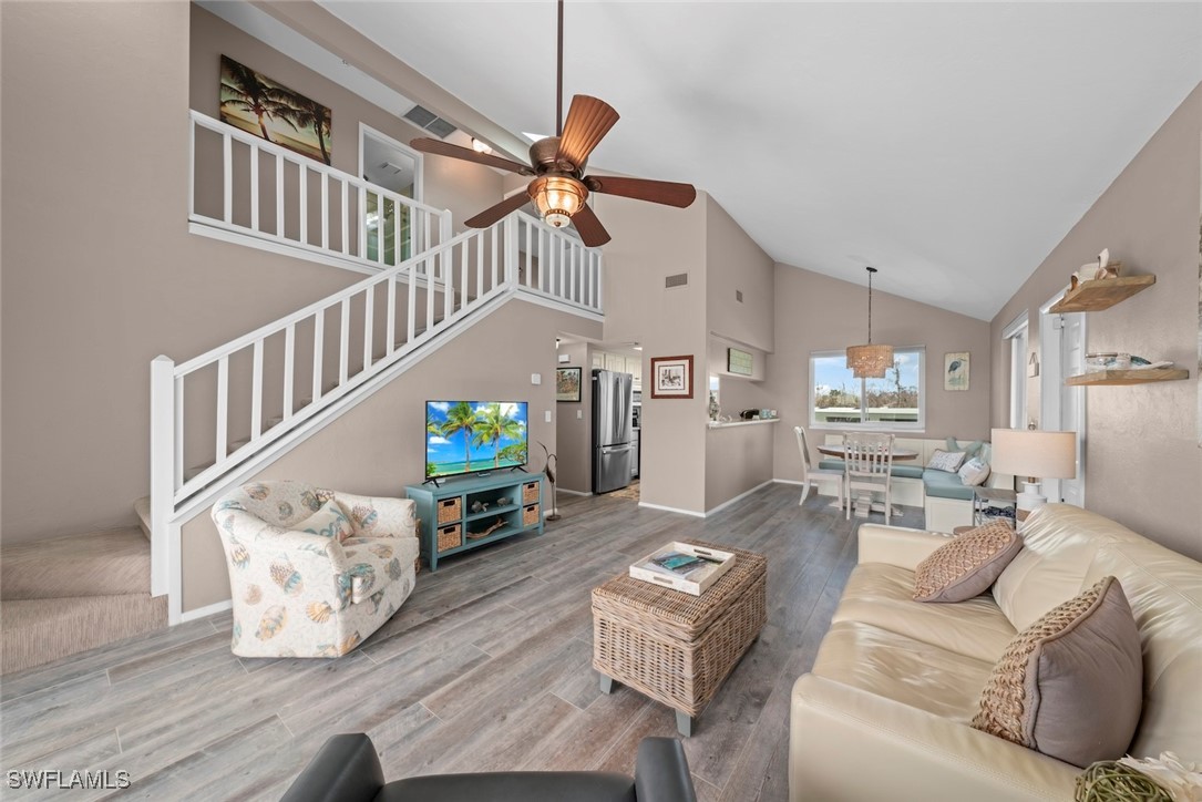 1651 Sand Castle Road Sanibel, FL 33957 - Photo 13 of 50 a living room with furniture and a chandelier
