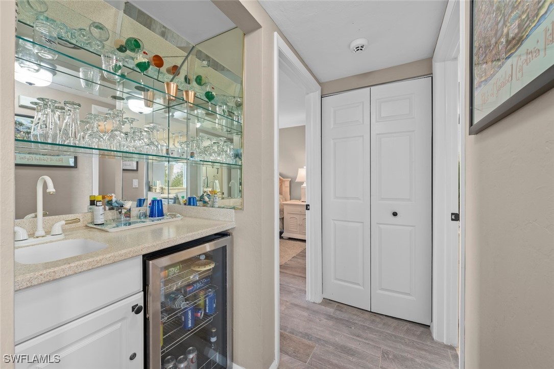 1651 Sand Castle Road Sanibel, FL 33957 - Photo 23 of 50 a kitchen with a sink and a mirror