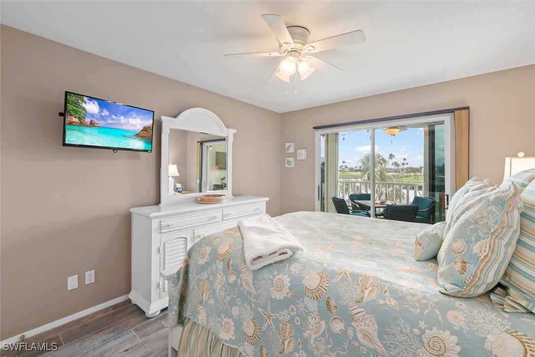 1651 Sand Castle Road Sanibel, FL 33957 - Photo 26 of 50 a spacious bedroom with a large bed and a window