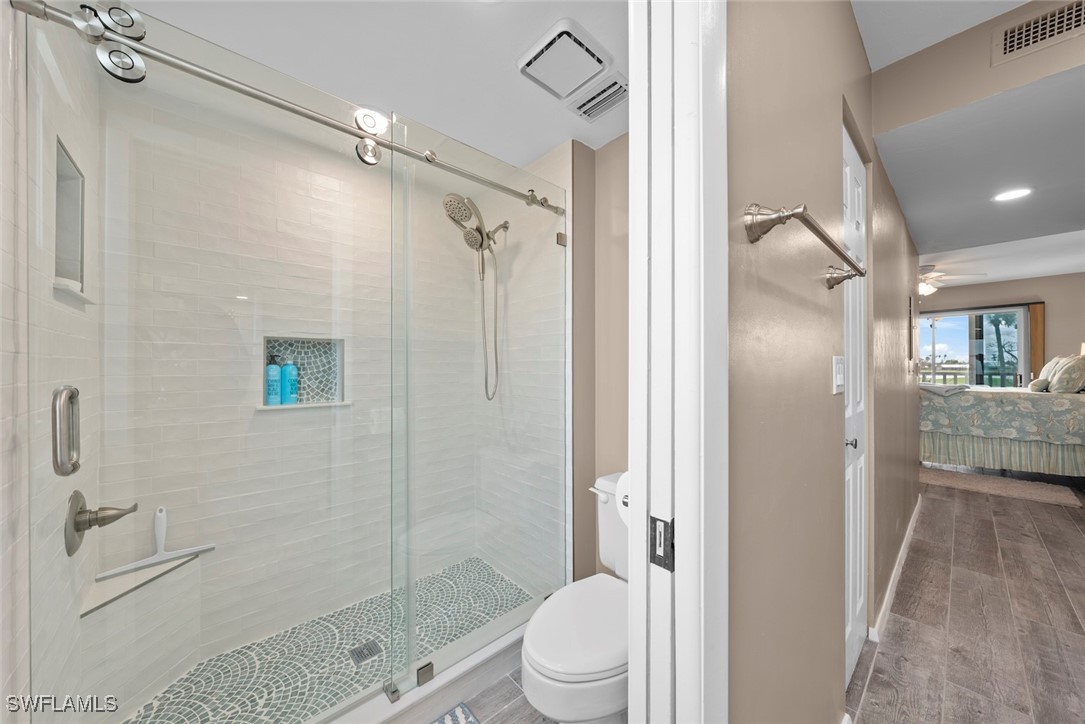 1651 Sand Castle Road Sanibel, FL 33957 - Photo 30 of 50 a bathroom with a shower a toilet and a shower
