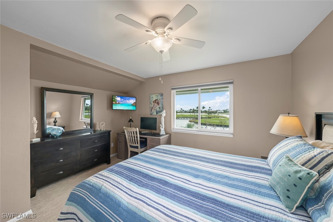 1651 Sand Castle Road Sanibel, FL 33957 - Photo 34 of 50 a bedroom with a bed and a dresser with mirror