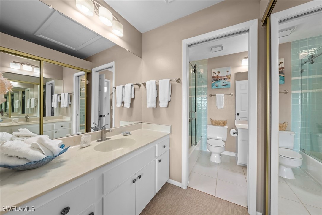 1651 Sand Castle Road Sanibel, FL 33957 - Photo 37 of 50 a spacious bathroom with a shower sink and mirror