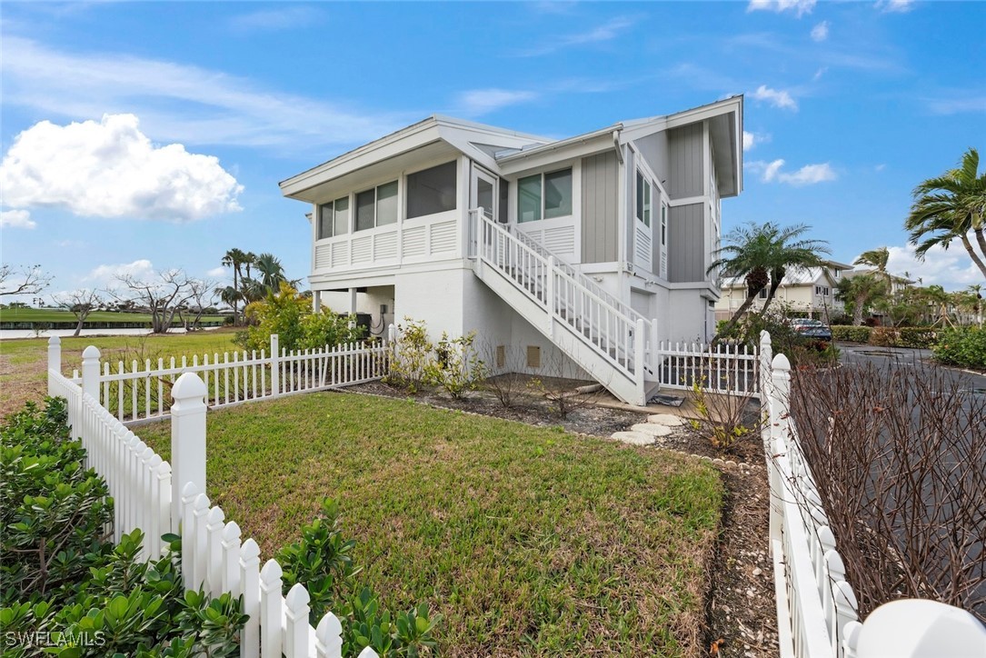 1651 Sand Castle Road Sanibel, FL 33957 - Photo 5 of 50 a view of a house with a yard and plants