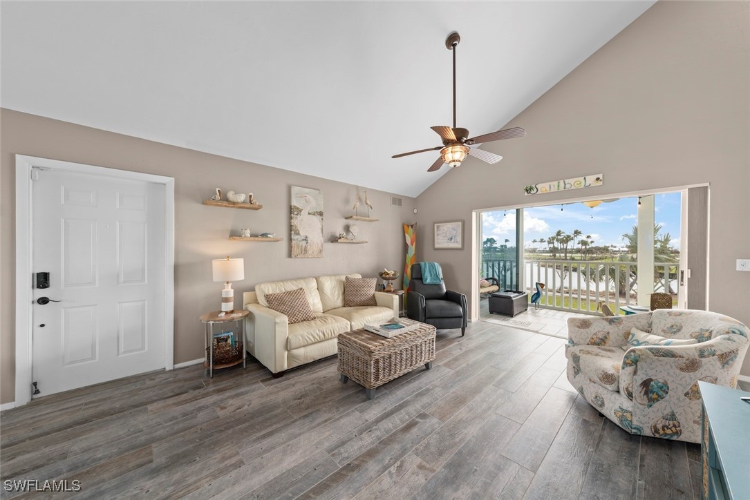 1651 Sand Castle Road Sanibel, FL 33957 - Photo 6 of 50 a living room with furniture and a large window