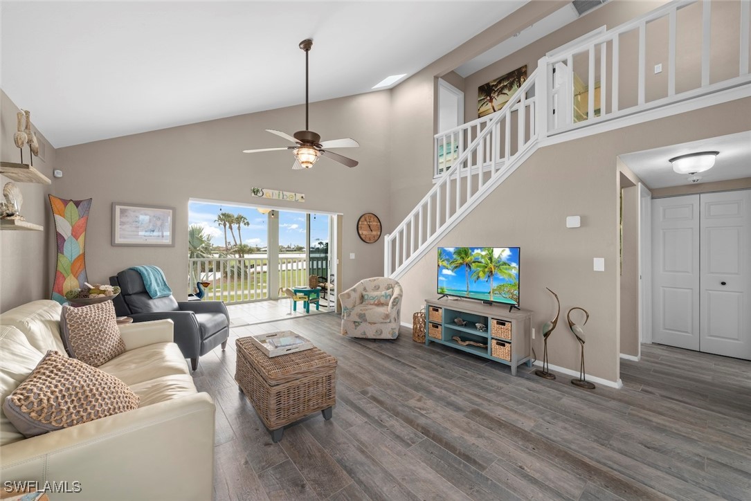 1651 Sand Castle Road Sanibel, FL 33957 - Photo 7 of 50 a living room with furniture and a flat screen tv