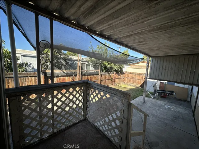 a view of a balcony with chairs