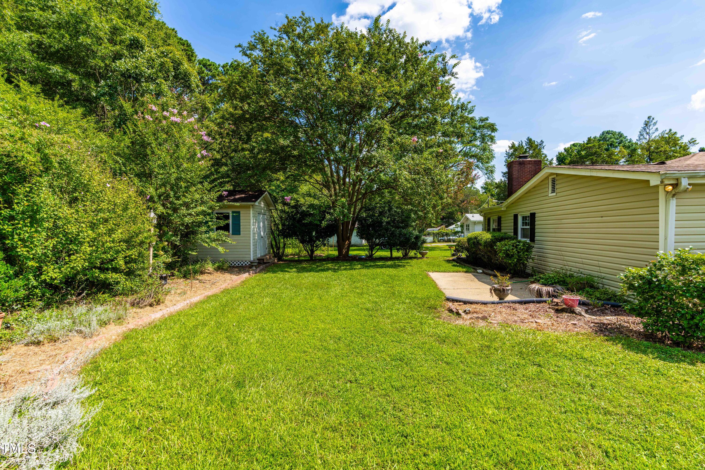 2616 Bullock Road Durham, NC 27704 - Photo 36 of 41 a view of a backyard with sitting area