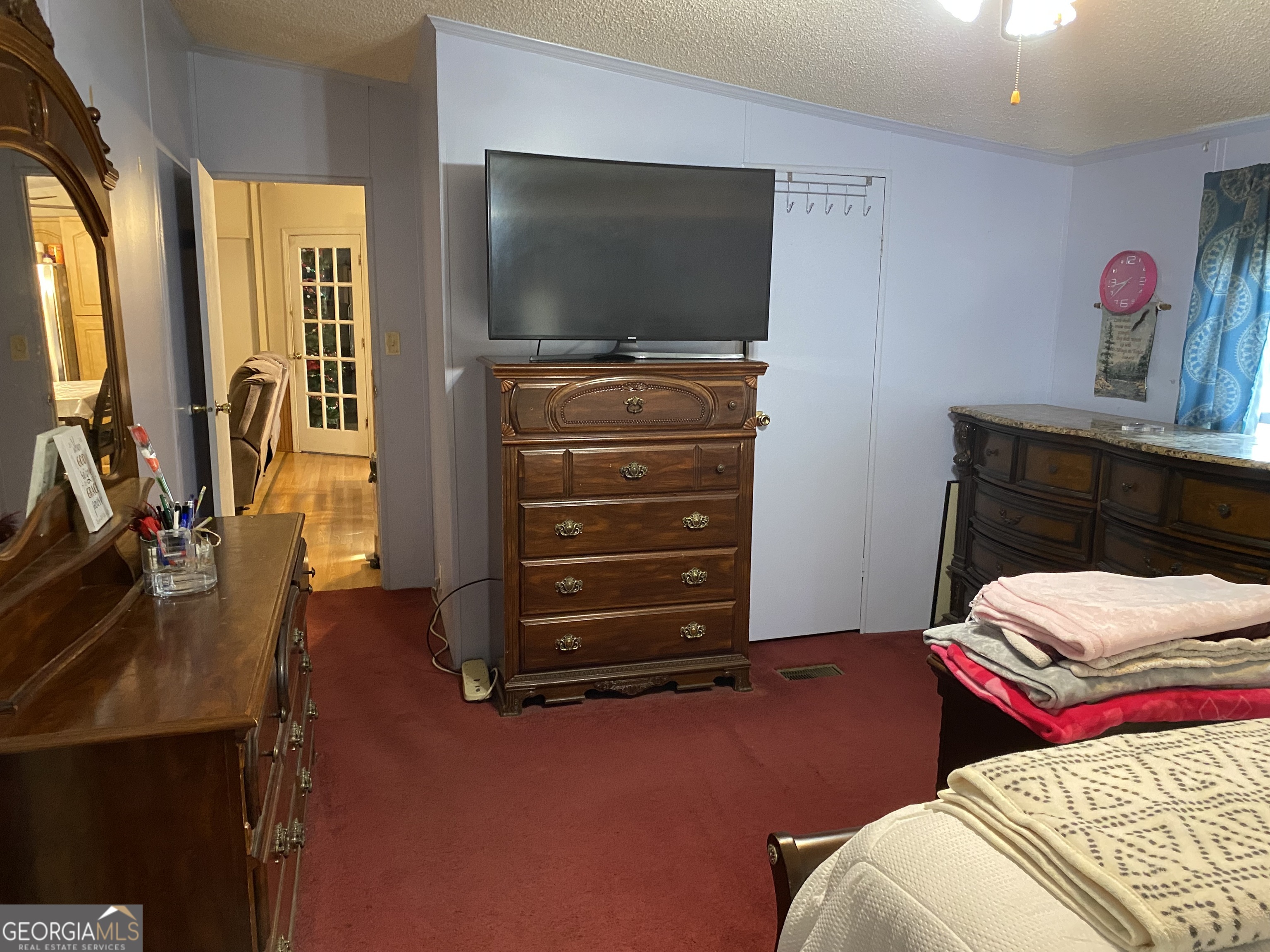 580 Centralia Rachels Road Warthen, GA 31094 - Photo 15 of 40 a bedroom with a bed and flat screen tv