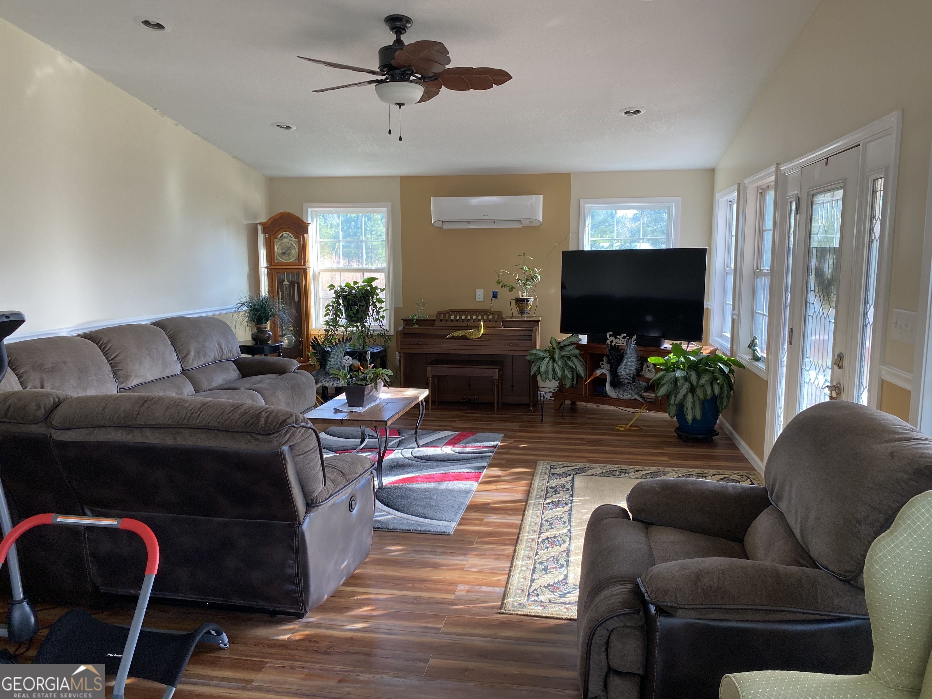 580 Centralia Rachels Road Warthen, GA 31094 - Photo 35 of 40 a living room with furniture a flat screen tv and a large window