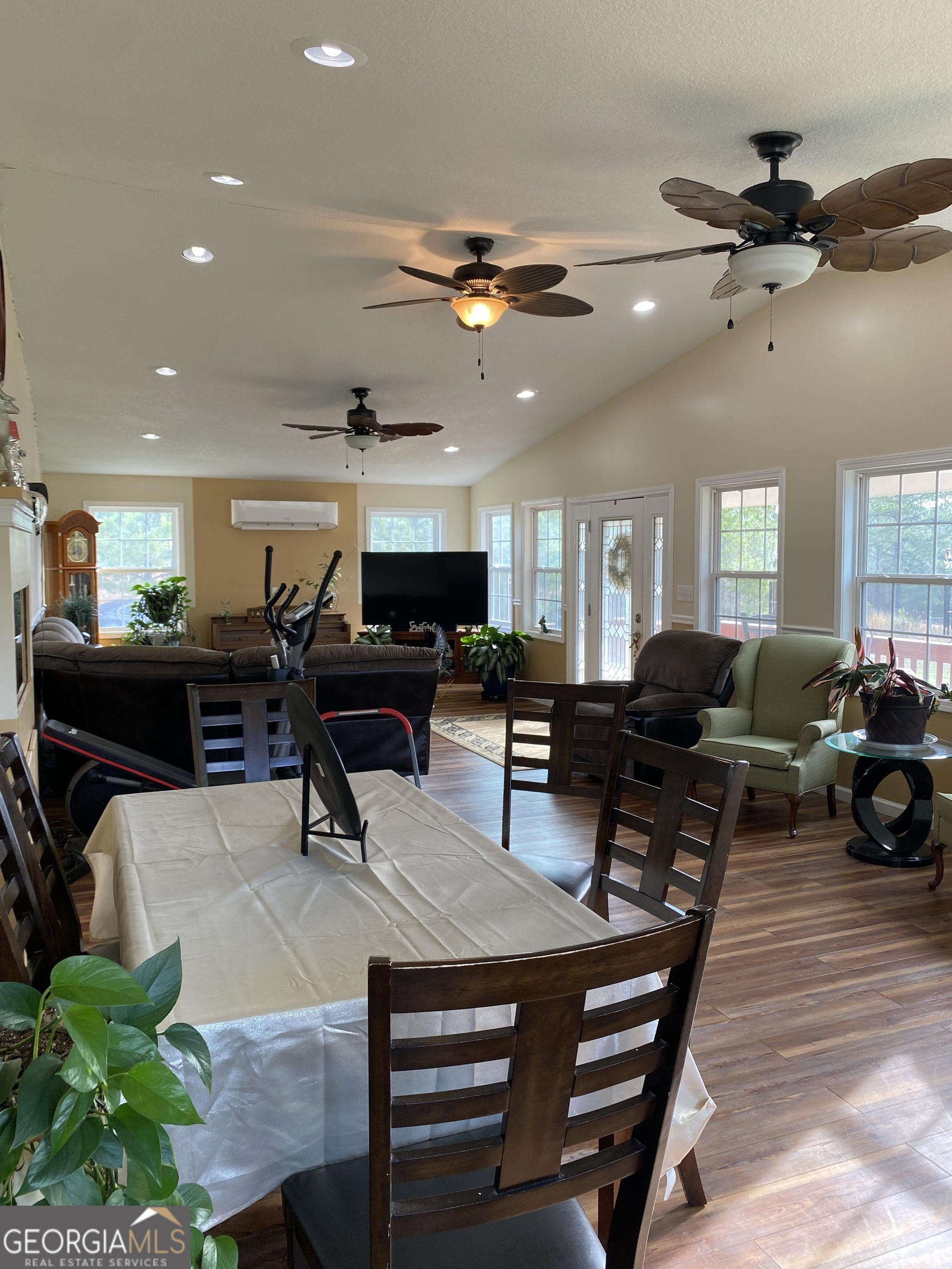 580 Centralia Rachels Road Warthen, GA 31094 - Photo 39 of 40 a living room with furniture a clock and a ceiling fan