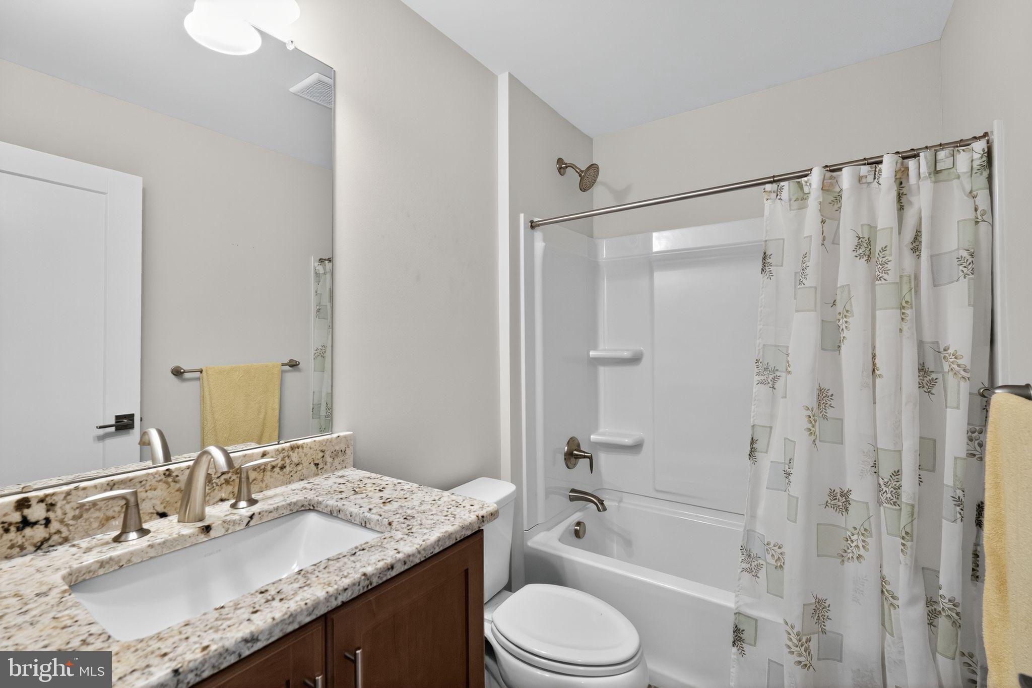417 Wynstone Court Colmar, PA 18915 - Photo 26 of 30 a bathroom with a granite countertop sink toilet and shower