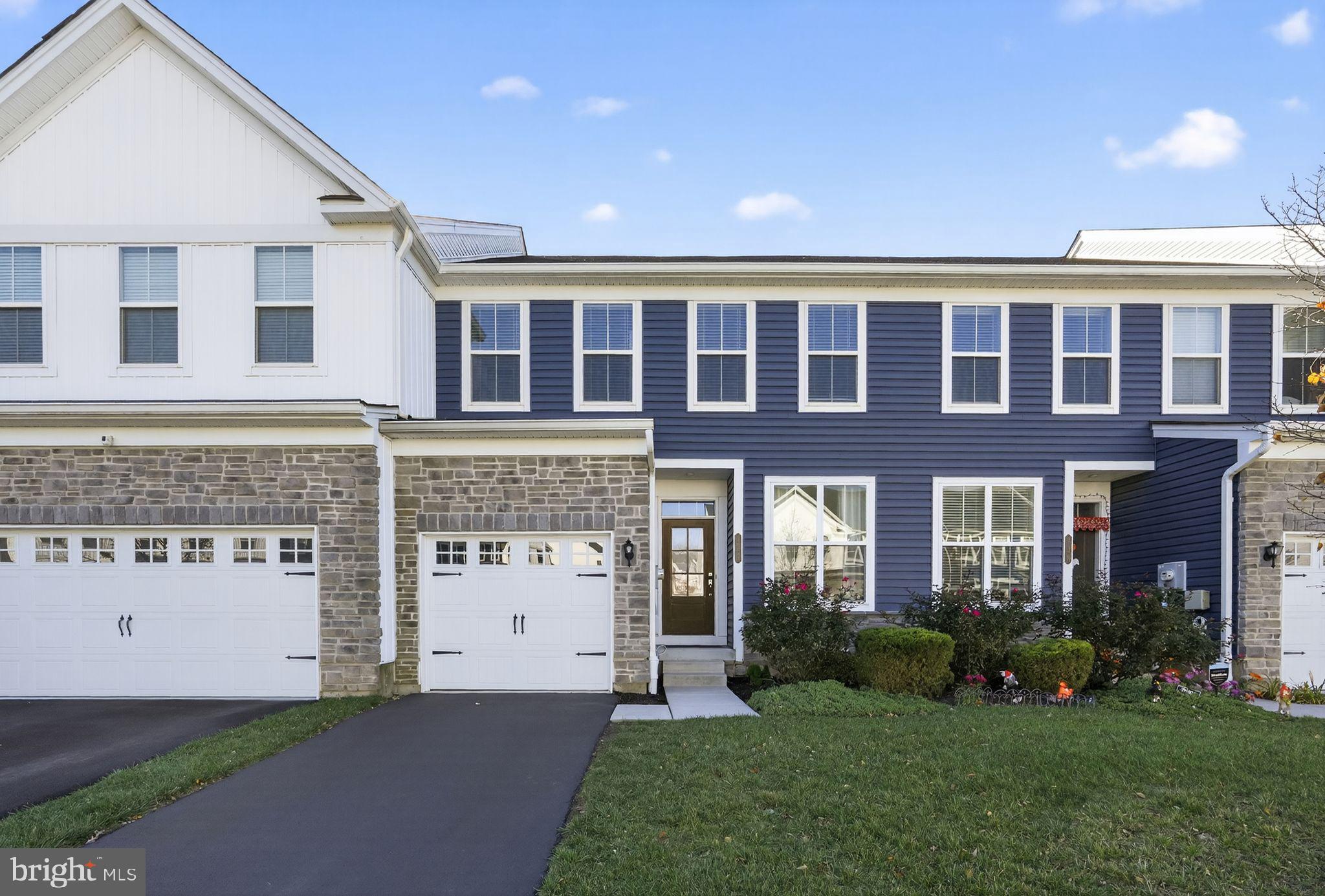 417 Wynstone Court Colmar, PA 18915 - Photo 29 of 30 a large brick building with a big yard and large trees