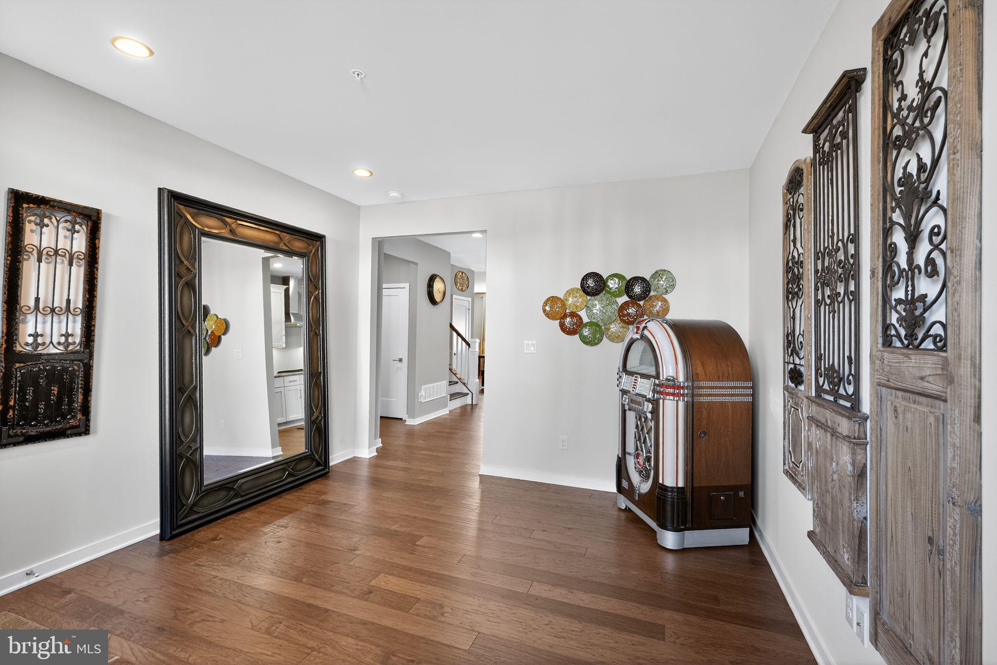 417 Wynstone Court Colmar, PA 18915 - Photo 3 of 30 a view of a hallway with wooden floor and staircase