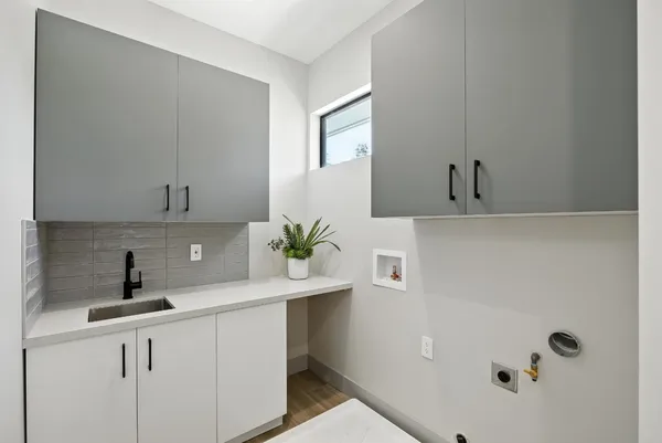 a living room with furniture a large window and a flat screen tv