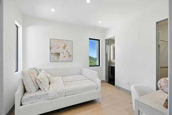 a view of a hallway with windows