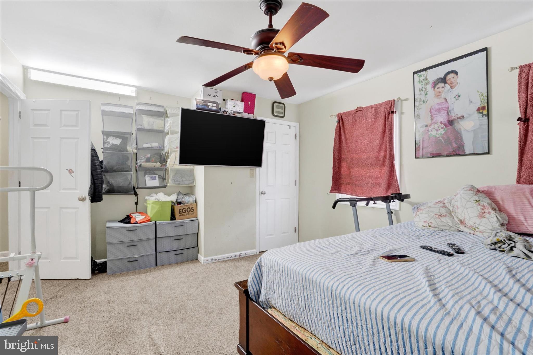 2455 Woodmont Drive York, PA 17404 - Photo 11 of 28 a bedroom with a bed and a flat screen tv