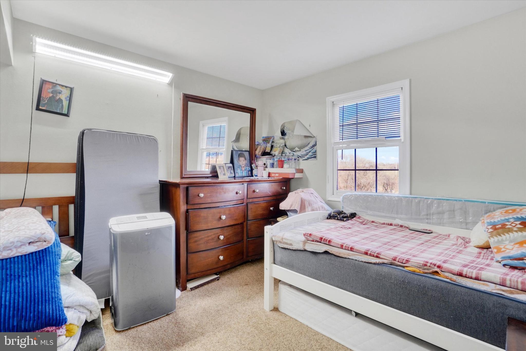 2455 Woodmont Drive York, PA 17404 - Photo 12 of 28 a bedroom with a bed and a window