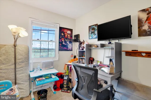 a room with furniture and a flat screen tv