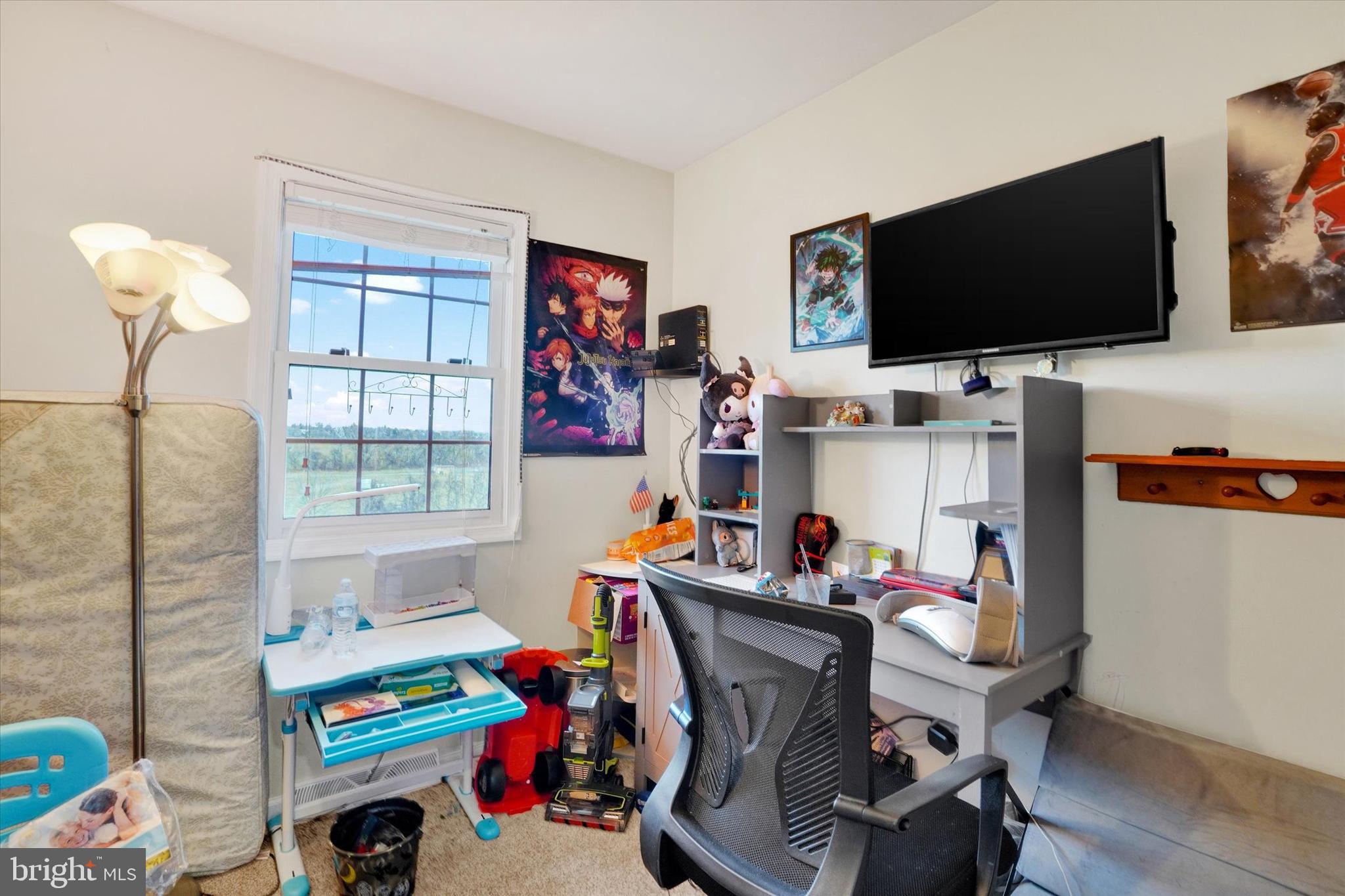 2455 Woodmont Drive York, PA 17404 - Photo 15 of 28 a room with furniture and a flat screen tv