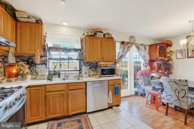 a kitchen filled counter top space and a sink