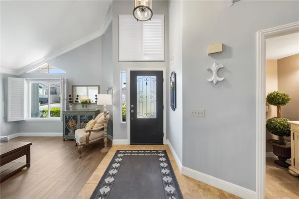 a view of a livingroom with furniture and hardwood floor