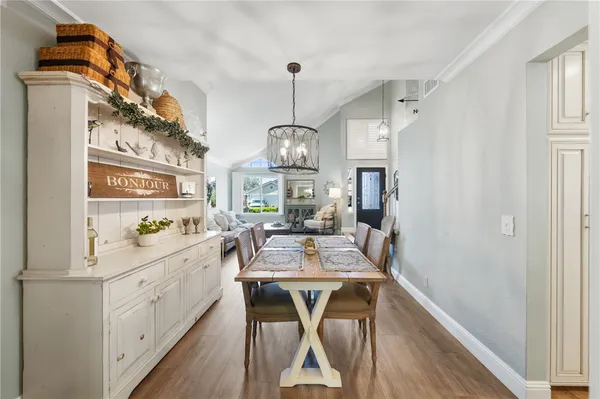 a very nice looking dining room with wooden floor