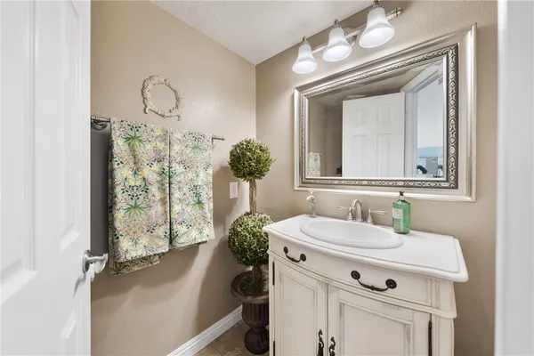 a kitchen that has a sink and a stove in it
