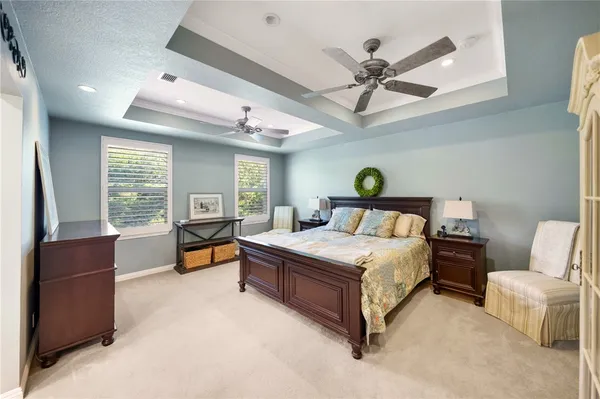 a spacious bedroom with a large bed and a window