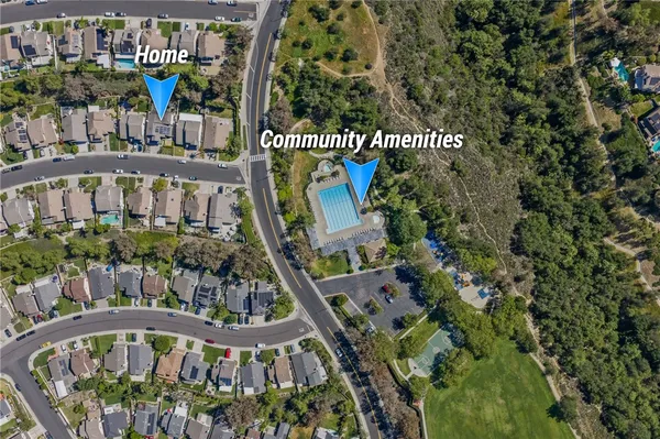 an aerial view of a house with a yard