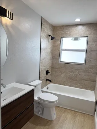 a bathroom with a sink a toilet and a bathtub