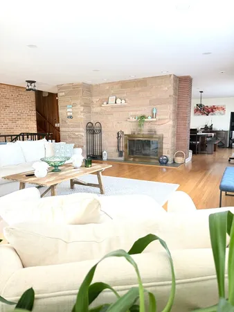 a view of a swimming pool with outdoor seating