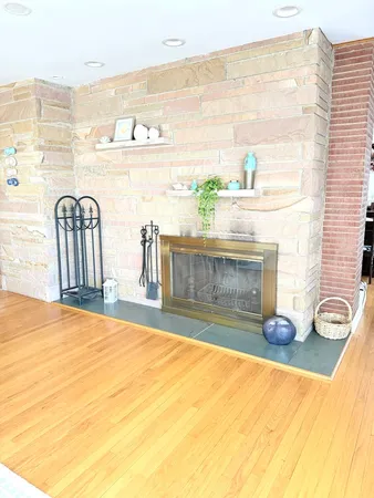 a bed sitting in a room next to a window