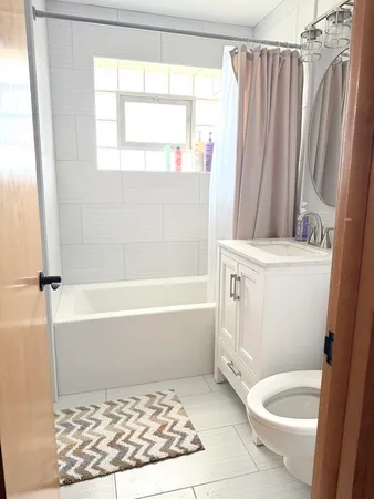 a bedroom with a bed and balcony view