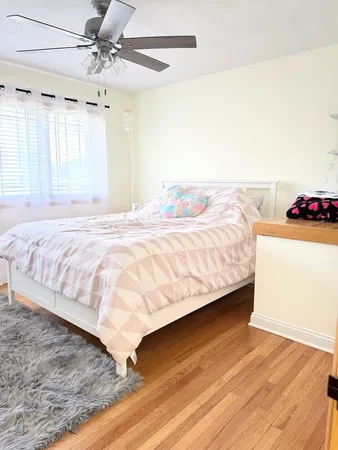 a bathroom with a sink mirror vanity and toilet