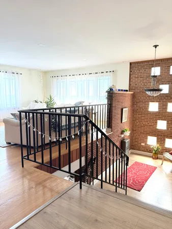 a view of staircase with a floor to ceiling window