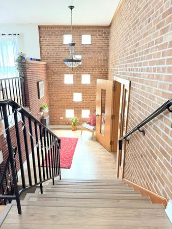 a view of a balcony with wooden floor