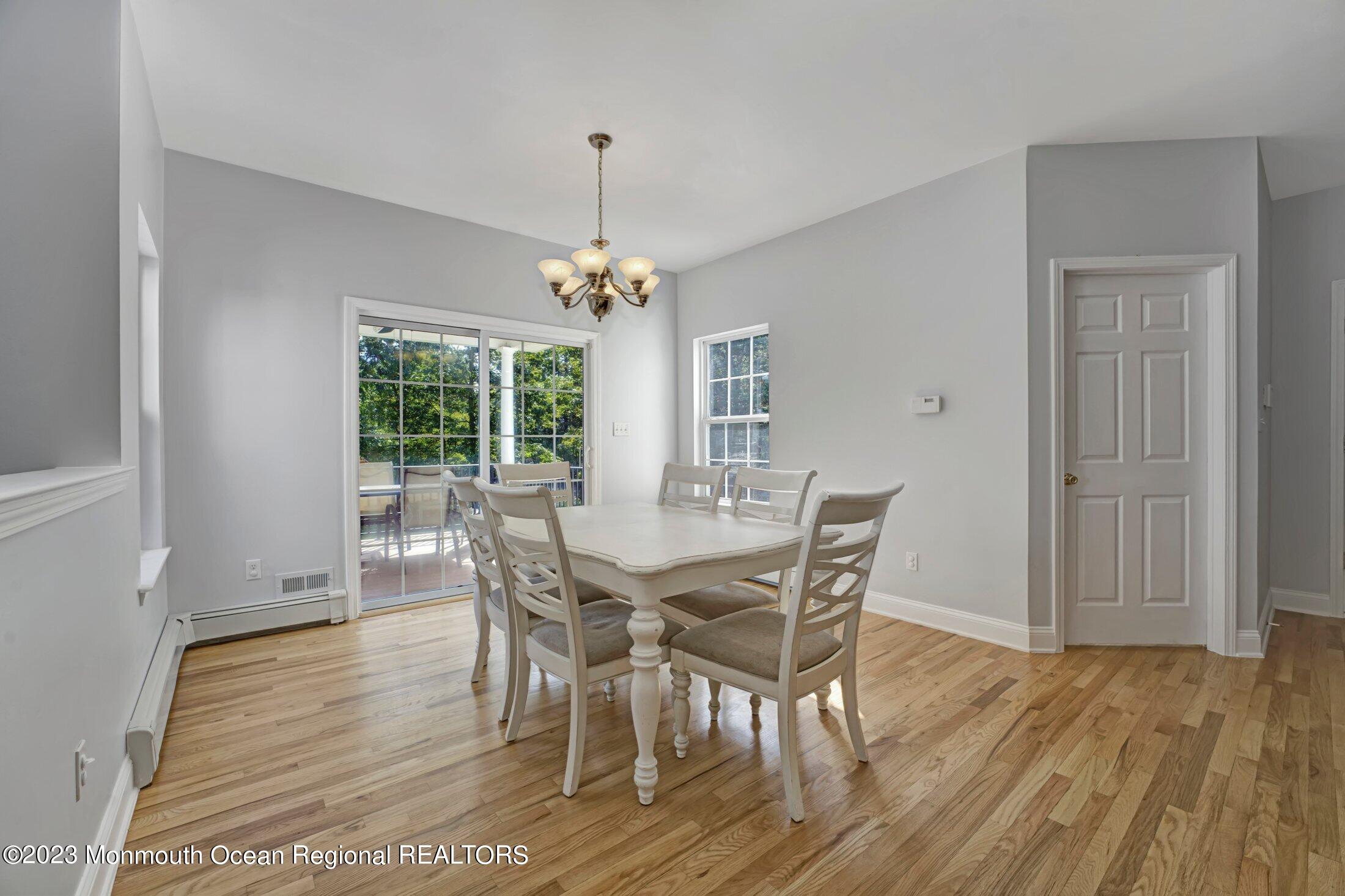 601 Reed Road Jackson, NJ 08527 - Photo 13 of 43 a view of a dining room with furniture window and wooden floor